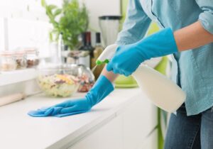 disinfecting kitchen countertop to reduce bacteria during summer