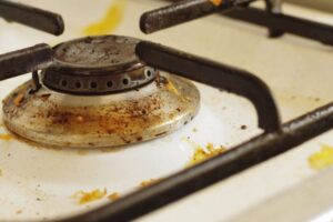 professional cleaner removing grease from kitchen cabinets in New Jersey